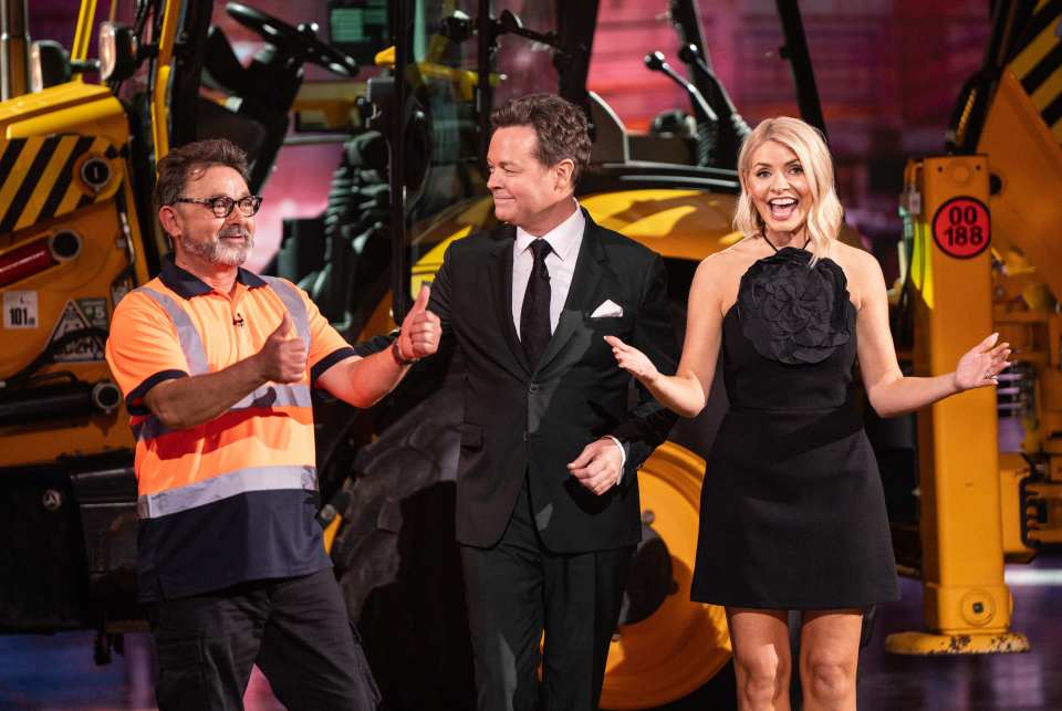 Will Power, Stephen Mulhern, and Holly Willoughby on a game show set.