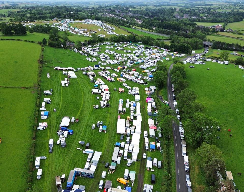 Aerial view of travelers queuing for a campsite.