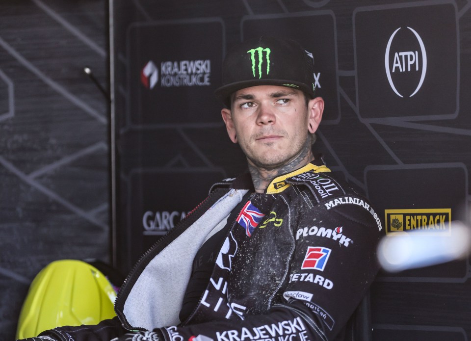 Speedway rider in racing suit.