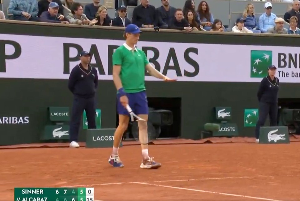 Tennis player on court during a match.
