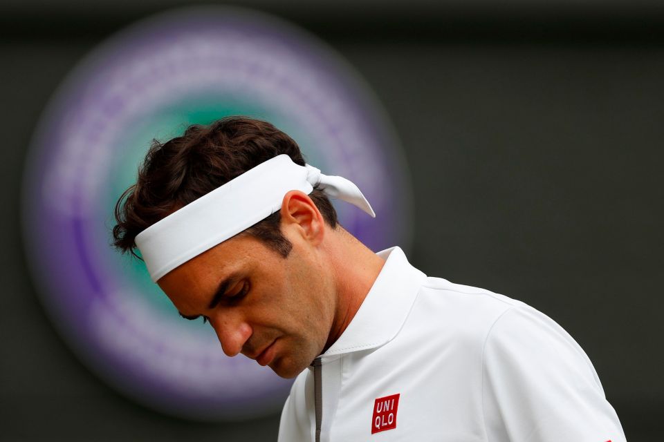 Roger Federer reacting after a point at Wimbledon.