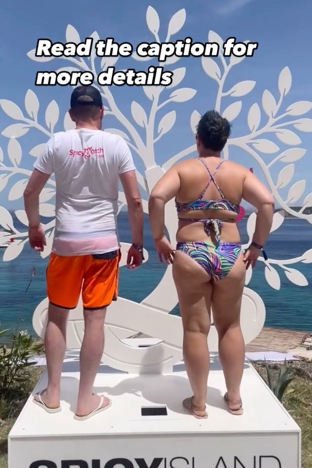 A pictfure of a couple standing backwards