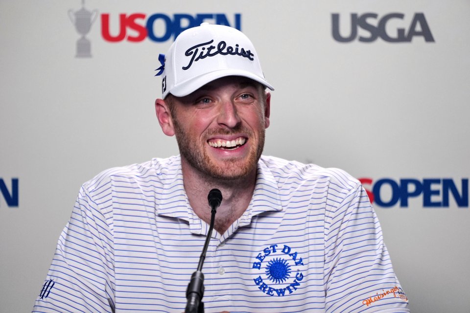 Matt Vogt smiling at a press conference.