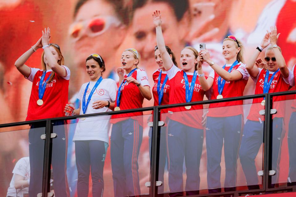 Arsenal women's team celebrating a trophy win.