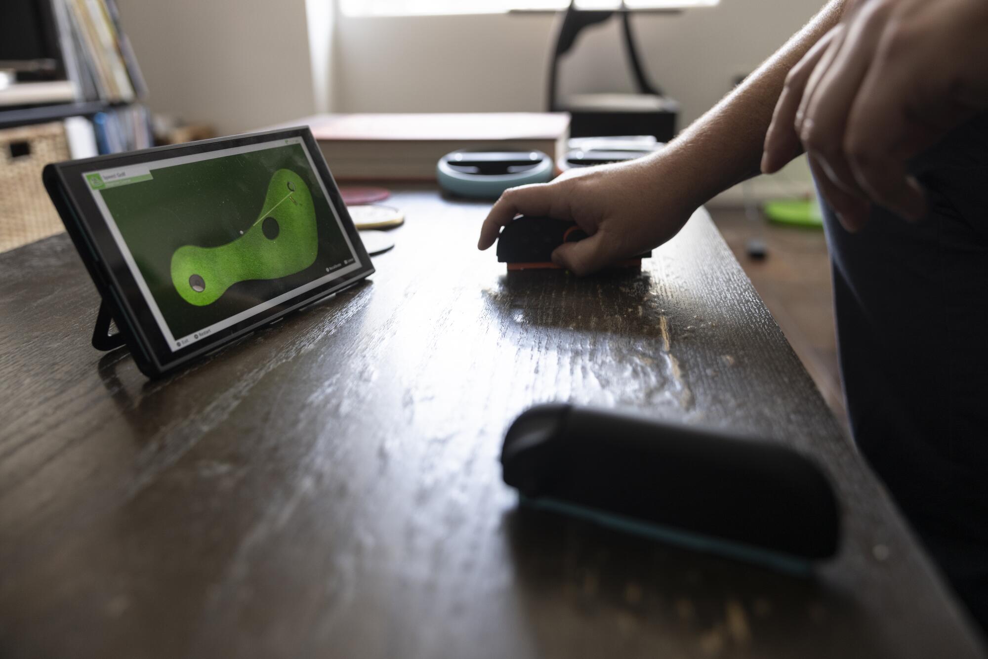The Nintendo Switch 2's detachable controllers being used as a mouse.