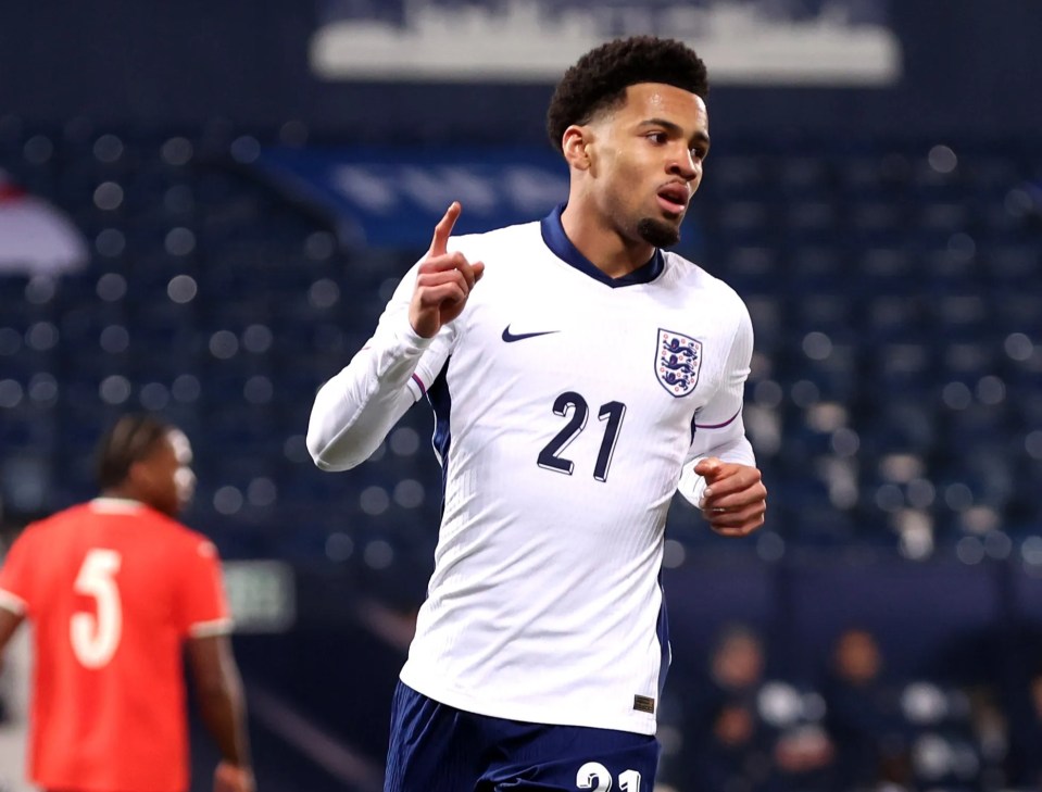 Ethan Nwaneri of England celebrates scoring a goal.