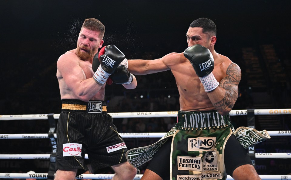 Jai Opetaia of Australia punches Claudio Squeo of Italy during an IBF Cruiserweight Title bout.