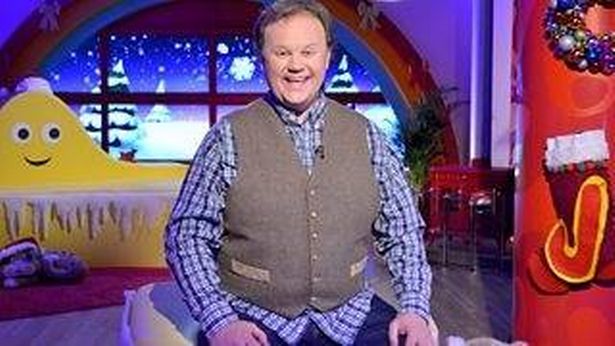 Justin Fletcher in a waistcoat on the set of Cbeebies