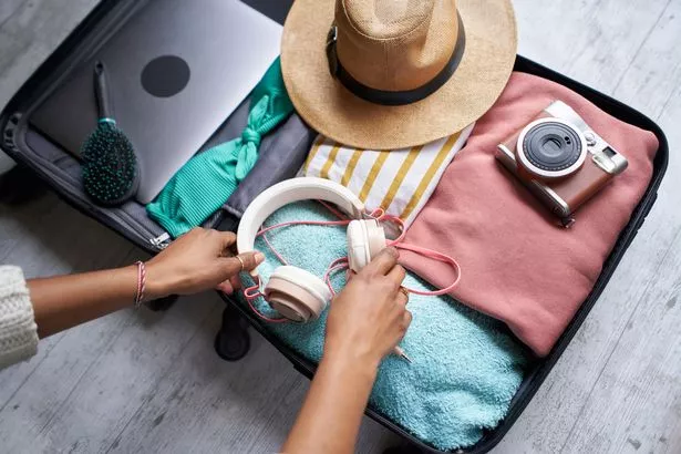 Image of open and packed suitcase