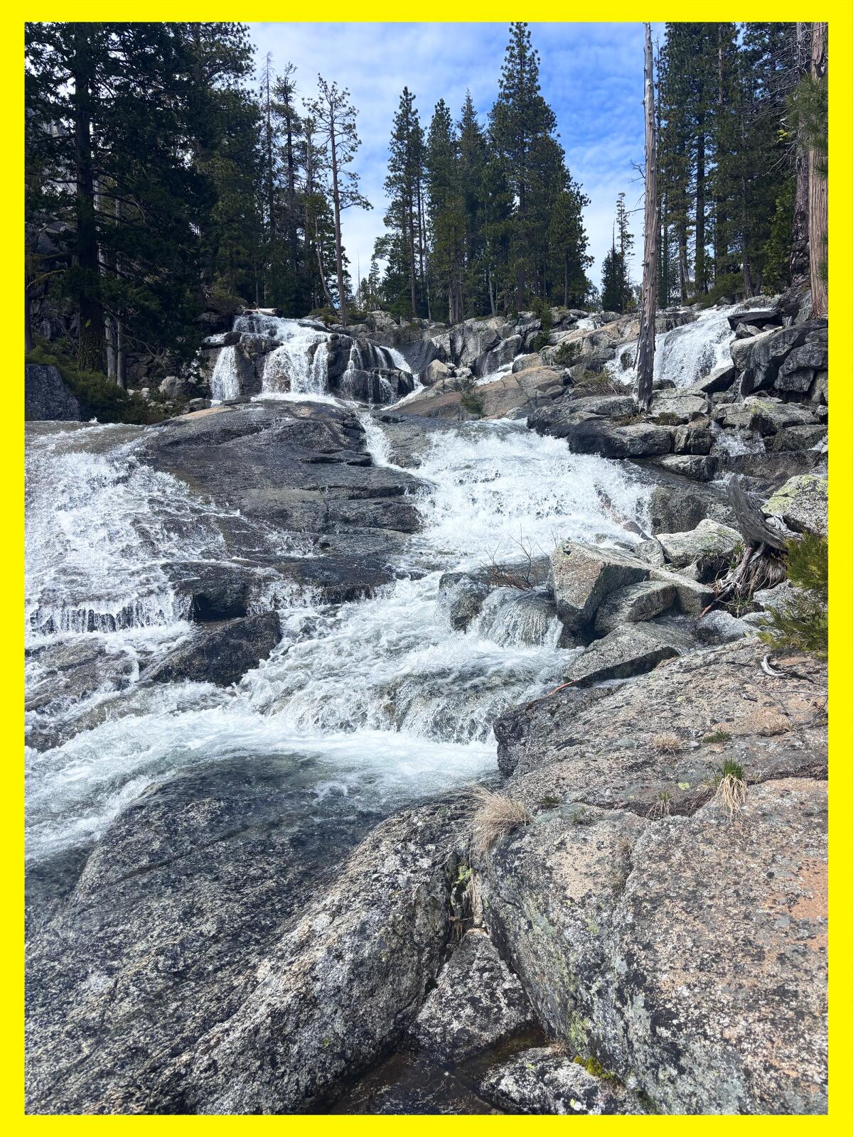 Large falls over multiple layers of boulders.