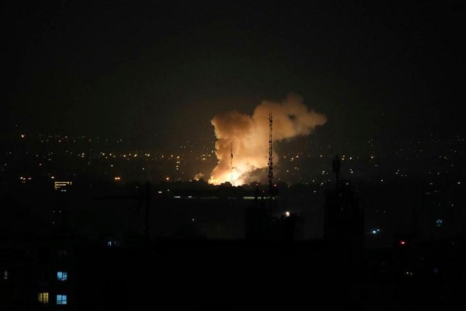 Smoke rising from an explosion in Tehran at night.