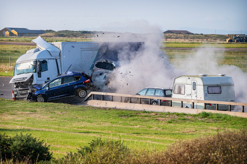 Remote-controlled lorry crashing into cars.