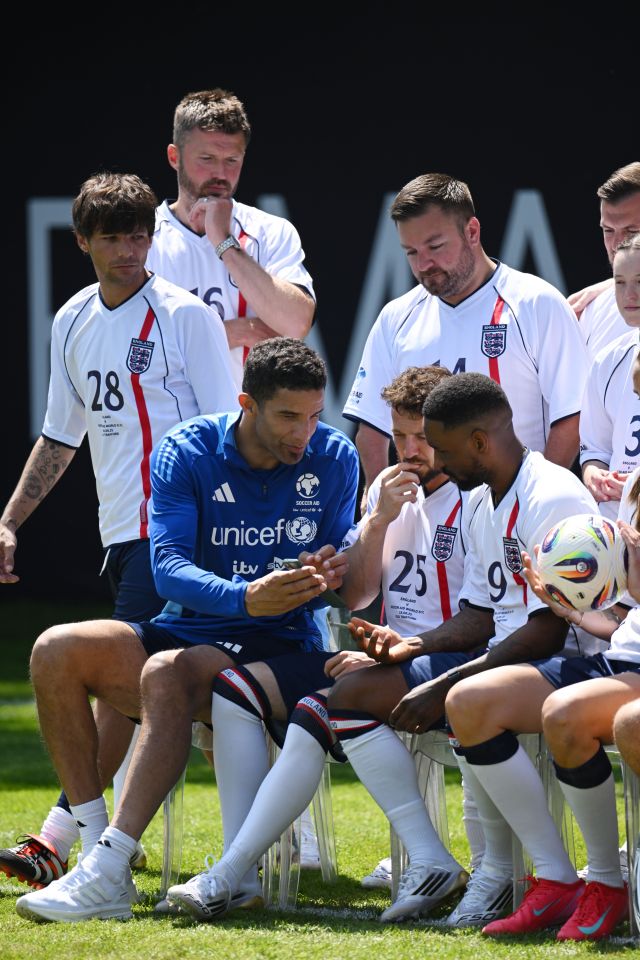 Soccer Aid for UNICEF 2025 training: players looking at a phone.
