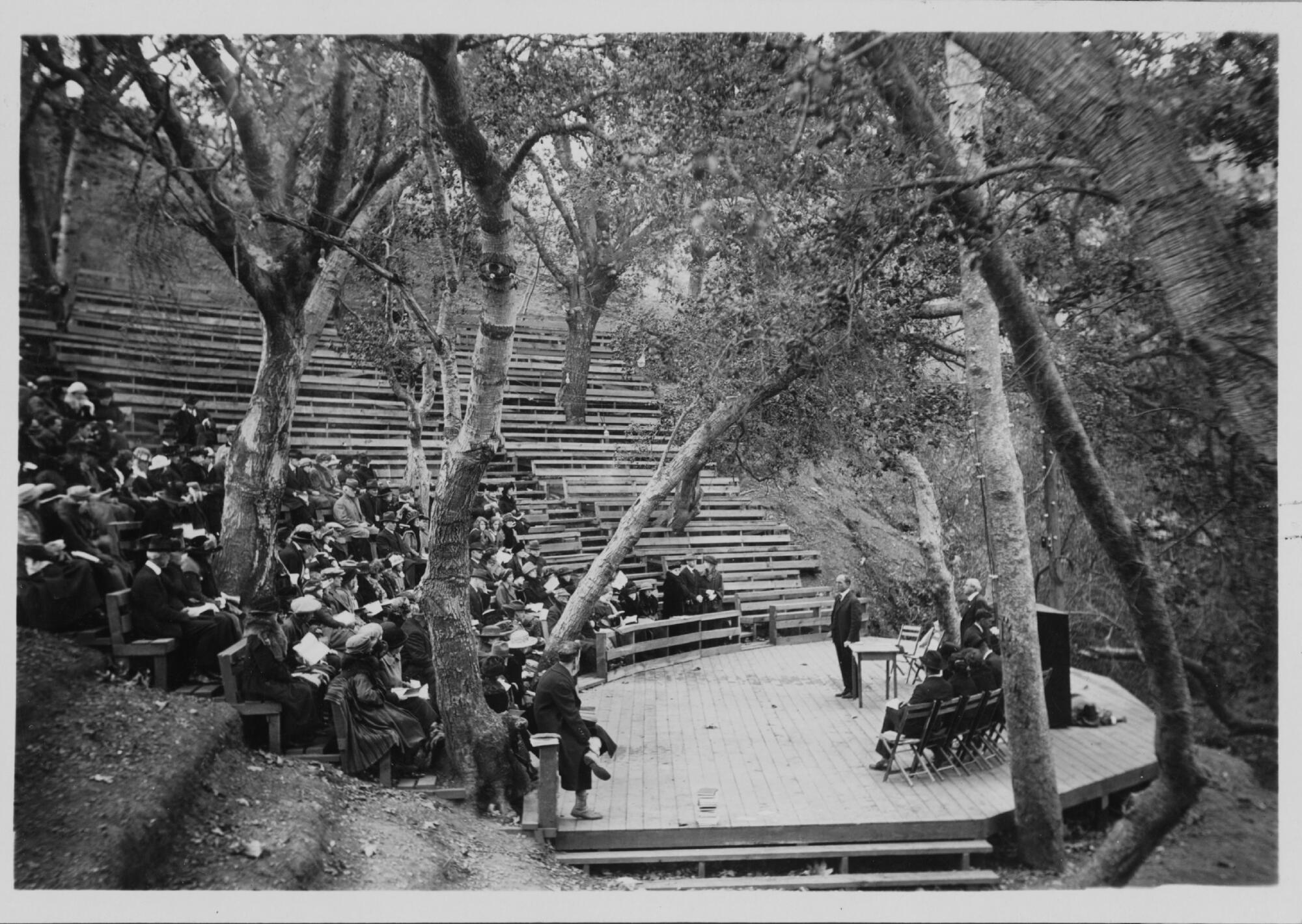 A 1922 Thanksgiving gathering fills rows of the since-destroyed amphitheater set under oaks and sycamores in Temescal Canyon.