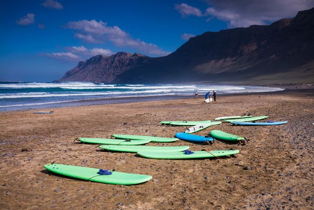 Image of surfboards on a beach in Famara