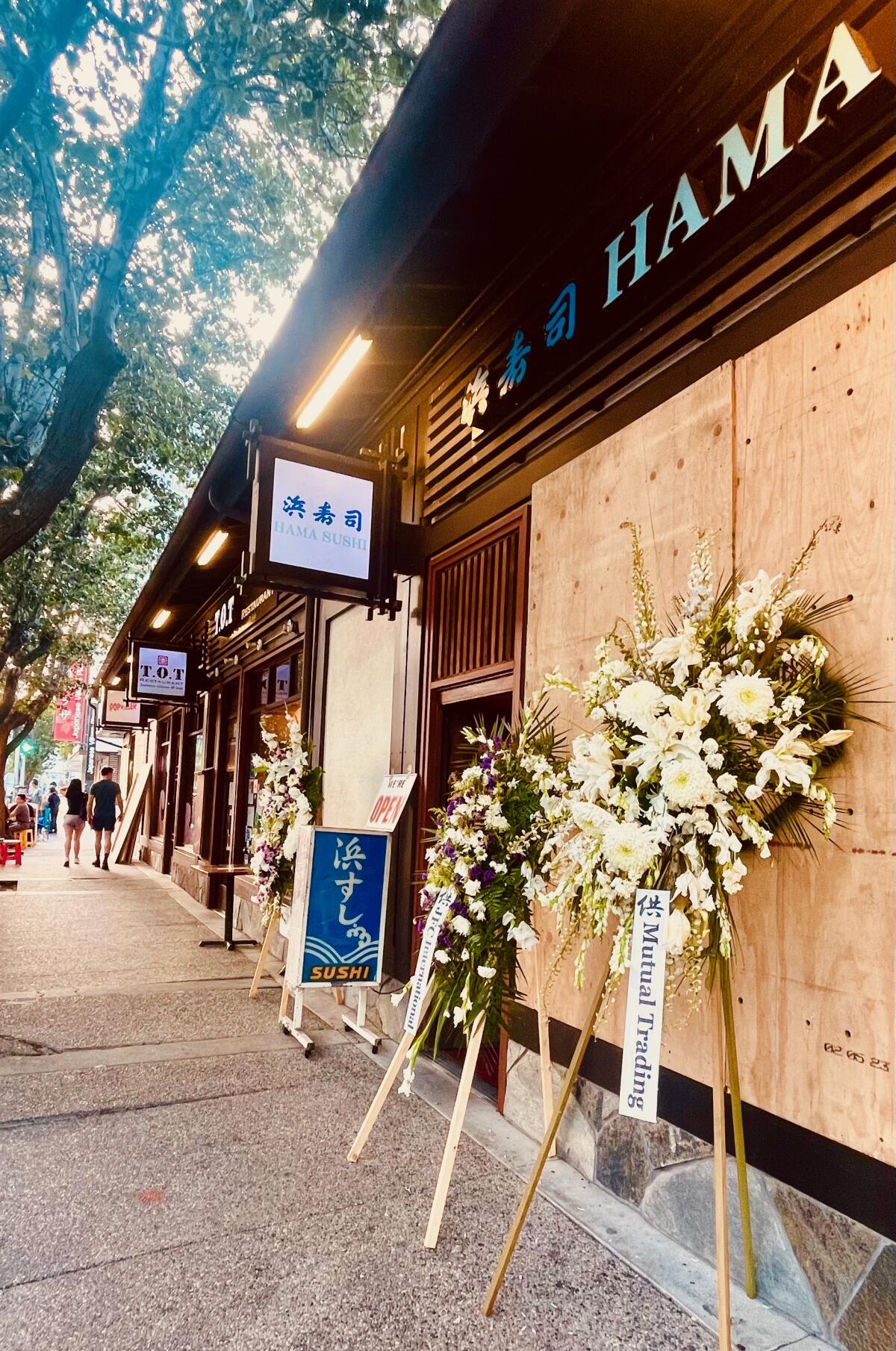 Funeral wreaths outside Hama Sushi in downtown L.A.'s Little Tokyo to honor the memory of longtime owner Tsutomu Iyama.