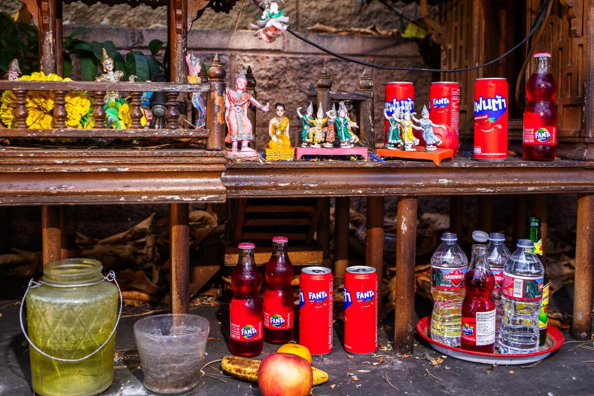 LOS ANGELES, JUNE 17, 2025 - Red Fanta presented as an offering at the spirit houses at Silom Supermarket in Thai Town  