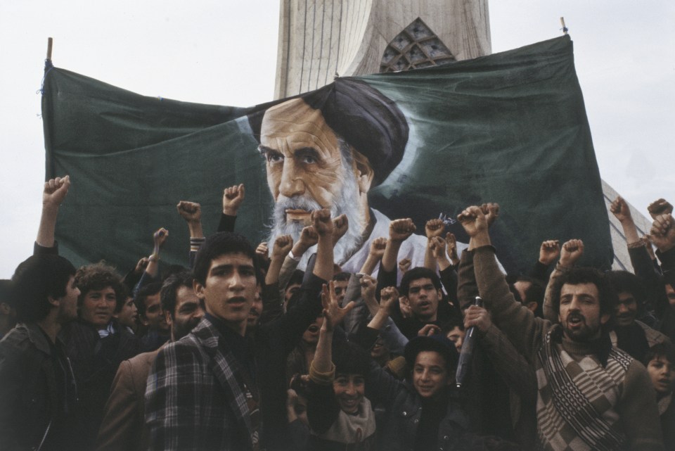 Iranian protesters in front of the Azadi Tower during the Iranian Revolution.