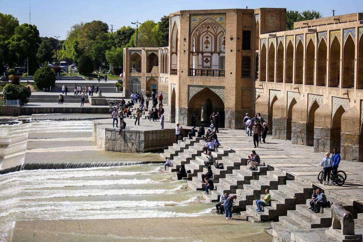 People visit the Khaju Bridge in Iran's central city of Isfahan.