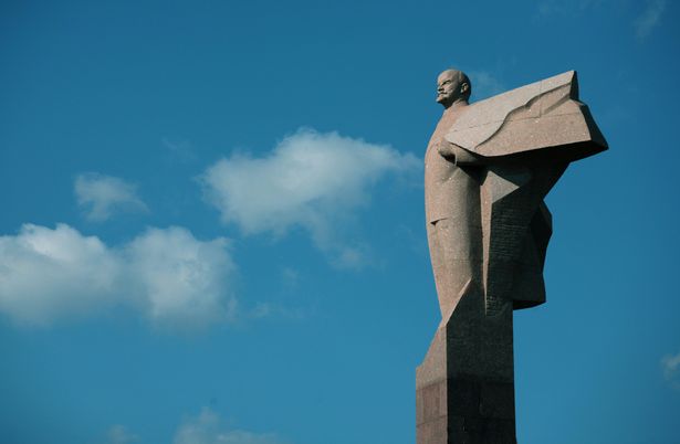 TIRASPOL,  MOLDOVA - OCTOBER 19: The statue of Lenin enthroned October 19, 2008 above the Transnistrian Government building in Tiraspol in the Transnistrian region in Moldova. Tiraspol is the second largest city in Moldova and is the capital and administrative centre of the de facto independent Pridnestrovian Moldavian Republic (Transnistria). The city is located on the eastern bank of the Dniester River. Tiraspol is a regional hub of light industry, such as furniture and electrical goods production. The Trans-Dnistrian Moldavian Republic, locatet in the eastern region of the country, is internationally not acknowledged but does have ist own president, currency and army. Transnistria - an internationally unrecognized state  is part of Moldavia. The region has been de facto idependent since 1991, after making a unilateral declaration of indepenence from Moldova and successfully defeated Moldavian forces in the war of Transnistria. Since than a ceasefire has held but Transnistria - where the most of the Moldavian Industry is located - is still a "frozen conflict" region.(Photo by Matthias Schumann/Getty Images)