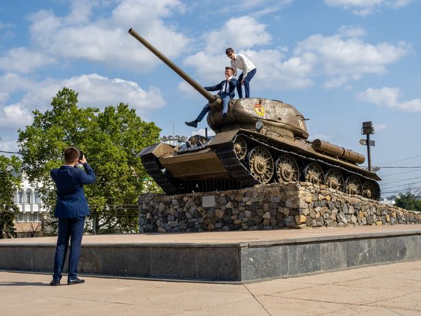 TIRASPOL, TRANSNISTRIA / MOLDOVA - SEPTEMBER 1: A decommissioned T-34 tank being used as a climbing frame, part of the Memorial of Glory monument positioned next to the orthodox church Sfantul Gheorghe on September 1, 2023 in Tiraspol, Moldova (Pridnestrovian Moldavian Republic). Tiraspol is the capital of Transnistria situated on the eastern bank of the Dniester River. Republic Day is the main state holiday. Transnistria broke away from Moldova in 1990 and is unrecognised by the international community as an independent state. The de-facto administration of Transnistria is supported economically, diplomatically, and militarily by Russia, which is believed to have 1,500 soldiers stationed there. (Photo by Peter Dench/Getty Images)