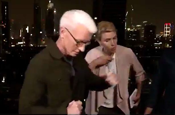 Anderson Cooper fleeing for shelter