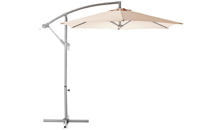 Beige cantilever patio umbrella.