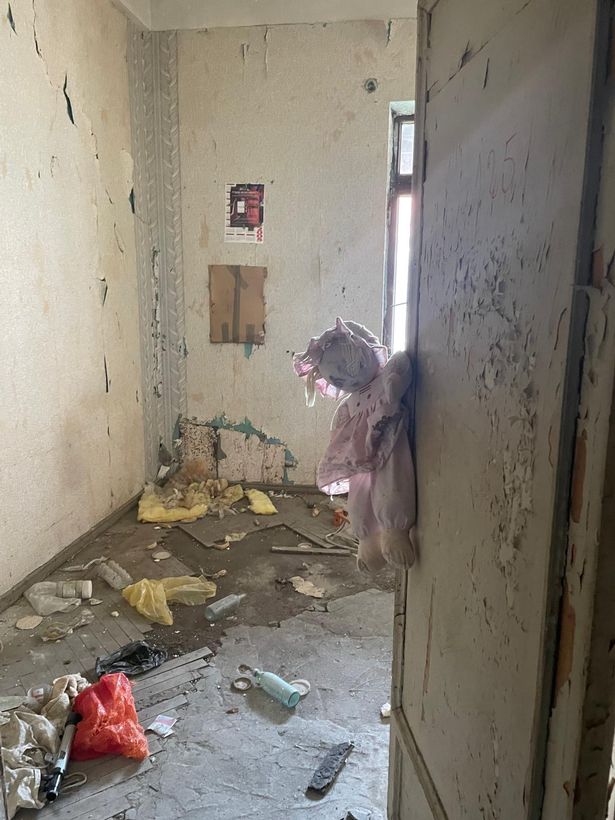 Doll tied to door