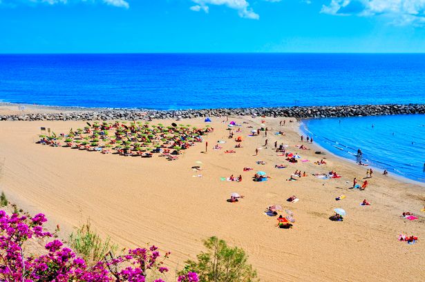 Maspalomas, Spain - October 9, 2013: Playa del Ingles beach  in Maspalomas, Gran Canaria, Canary Islands, Spain. This is an important winter tourist destination for many europeans