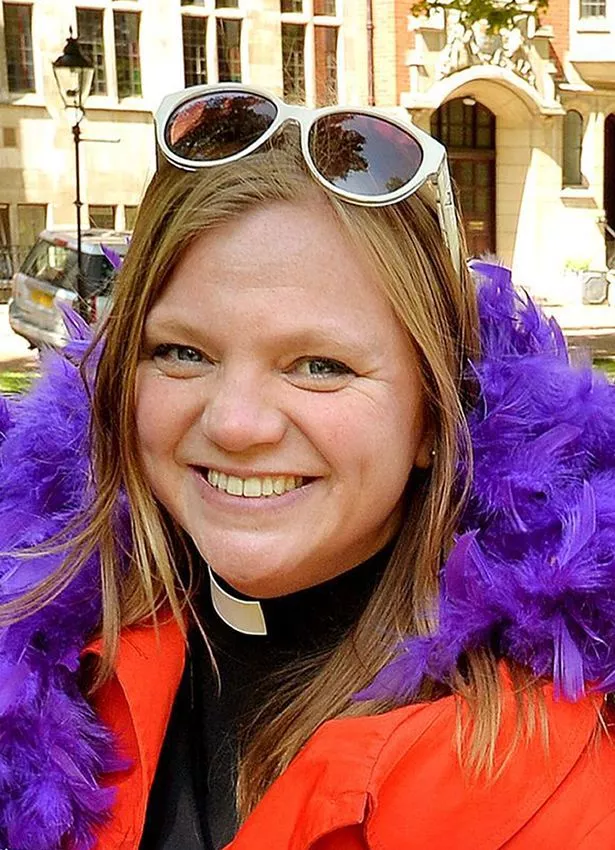 Reverend Kate Bottley in an orange jacket.