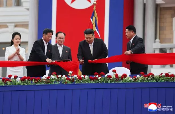 In this photo provided by the North Korean government, North Korean leader Kim Jong Un, second right, with his daughter, left, cuts the inaugural tape during a completion ceremony of the Wonsan-Kalma coastal tourist zone in North Korea Tuesday, June 24, 2025. Independent journalists were not given access to cover the event depicted in this image distributed by the North Korean government. The content of this image is as provided and cannot be independently verified. Korean language watermark on image as provided by source reads: "KCNA" which is the abbreviation for Korean Central News Agency. (Korean Central News Agency/Korea News Service via AP)