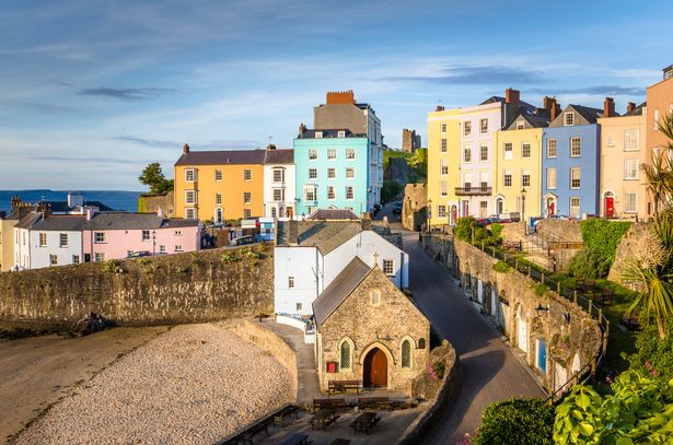 Pastel coloured town houses overlooking the harbour in Tenby, Wales.