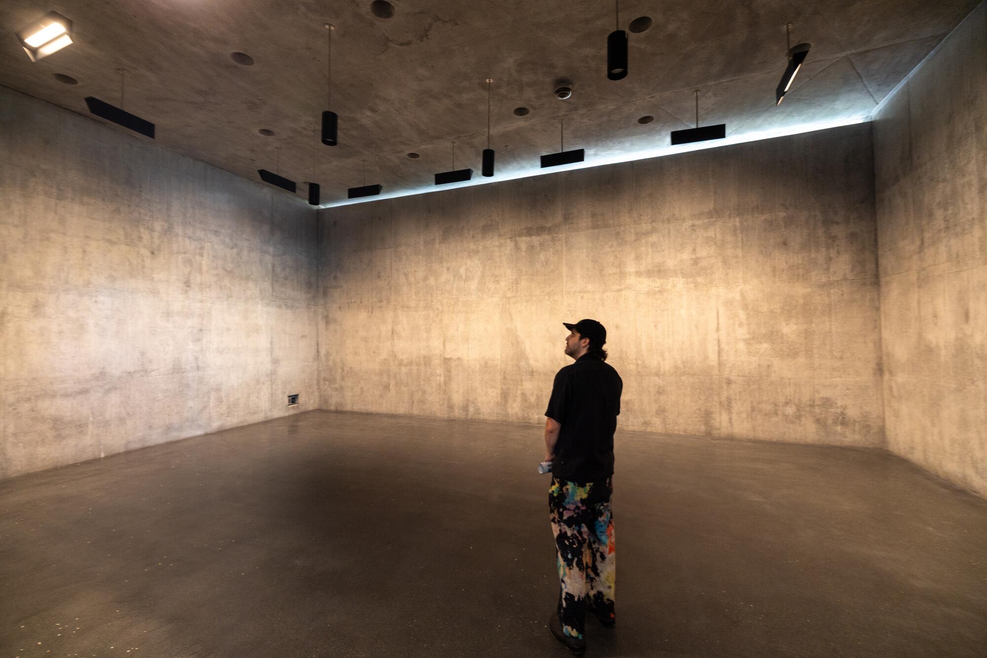 On the first preview day of LACMA's new building, a guest walks through one of the galleries of the Peter Zumthor design.