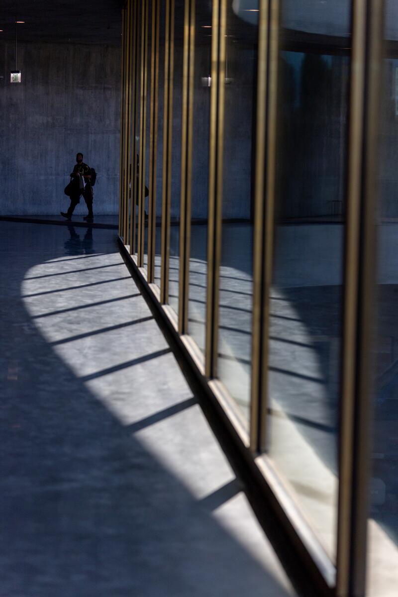Los Angeles, CA - June 26: Guests tour the space as LACMA opens its new main building to media and museum members at Los Angeles County Museum of Art in Los Angeles Thursday, June 26, 2025. The Peter Zumthor-designed building is empty - a single story expanse of raw concrete that crosses Wilshire Boulevard and purports to deliver views of the city. We want to give a readers a sense of what the building feels like inside, before all of the art gets installed later this year (and before curtains go up around all of that glass). (Allen J. Schaben / Los Angeles Times)