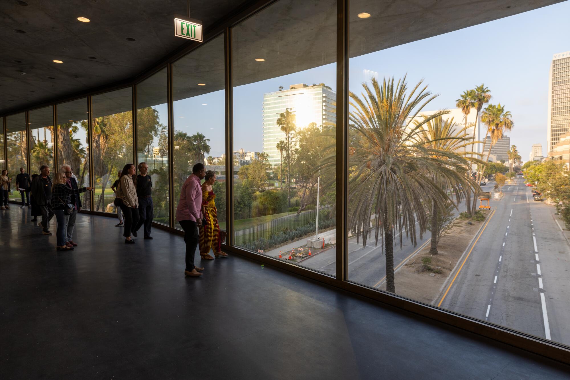 Guests walk the part of the new LACMA building that spans Wilshire Boulevard.