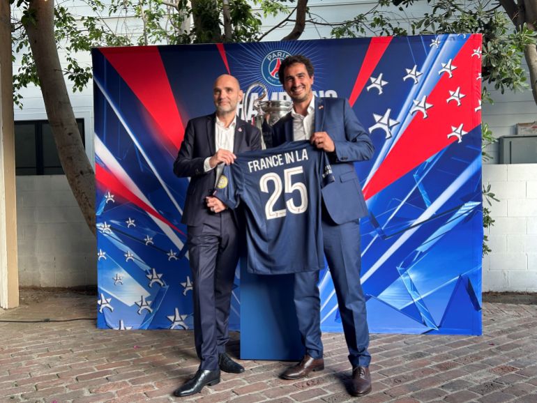 Paris St Germain CEO Victoriano Melero and Adrien Frier, the French consul-general in Los Angeles, pose for a picture in Beverly Hills