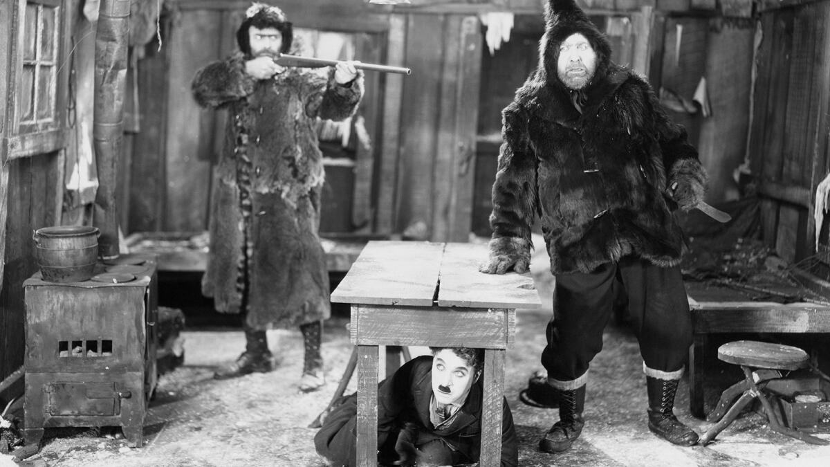 A little tramp hides under a table from competing prospectors.
