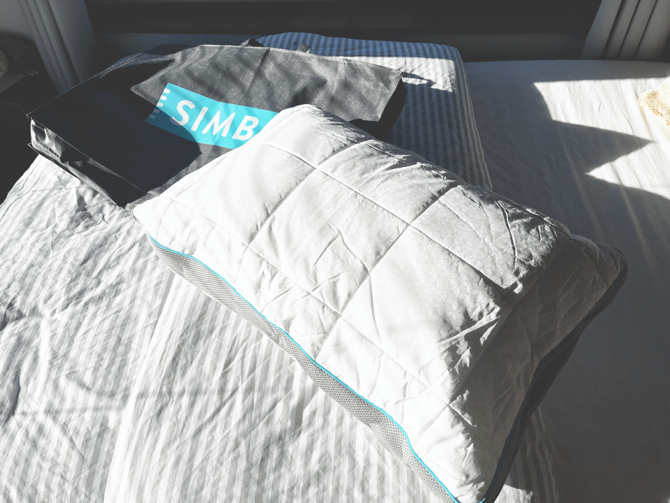 White pillow on a bed.