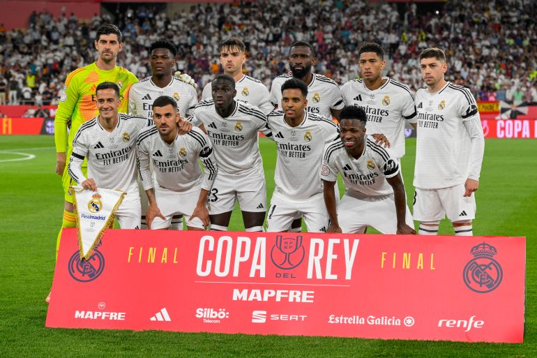 Real Madrid players react.