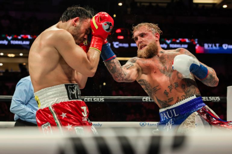 Jake Paul, right, punches Julio Cesar Chavez Jr. during their cruiserweight boxing match on Saturday, June 28, 2025, in Anaheim, Calif. (AP Photo/Etienne Laurent)