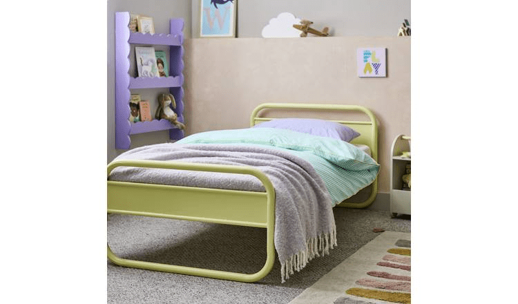 Pale yellow metal children's bed with pastel bedding.
