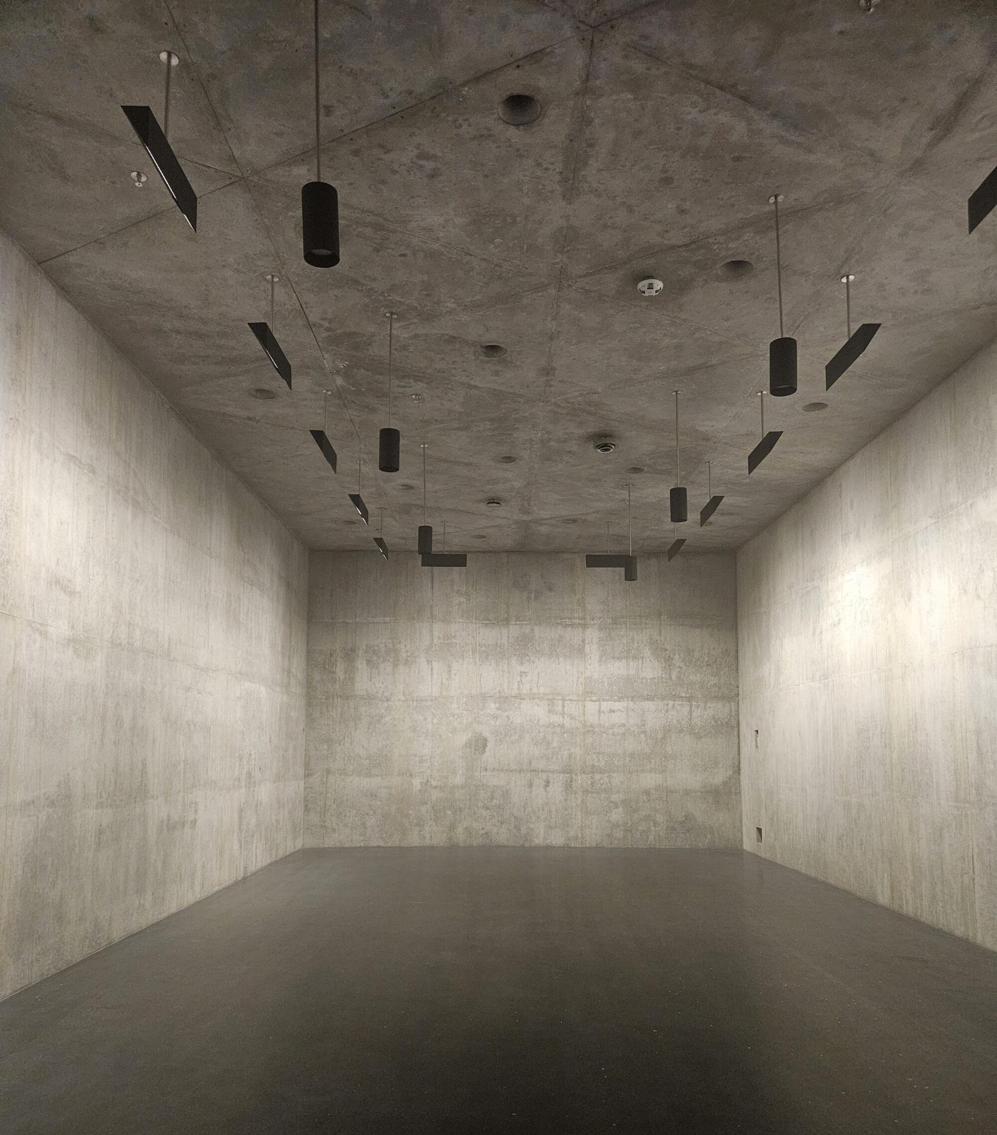 All surfaces of 90 bunker-like galleries are concrete, with plans for drilling holes and pounding in anchors to hang art.