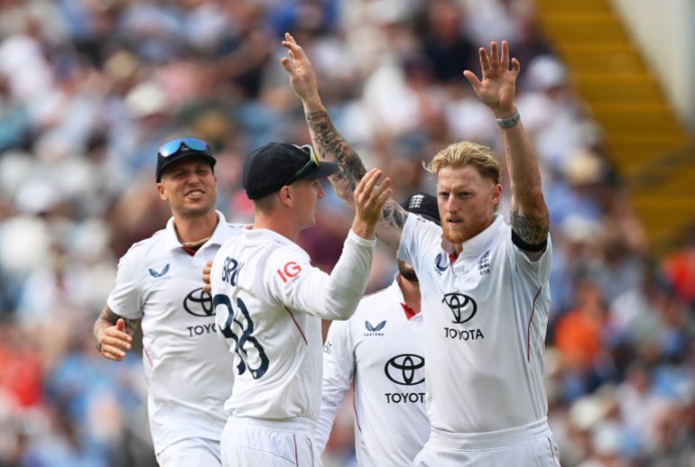 Ben Stokes of England celebrates with teammate Harry Brook after taking the wicket of Yashasvi Jaiswal of India