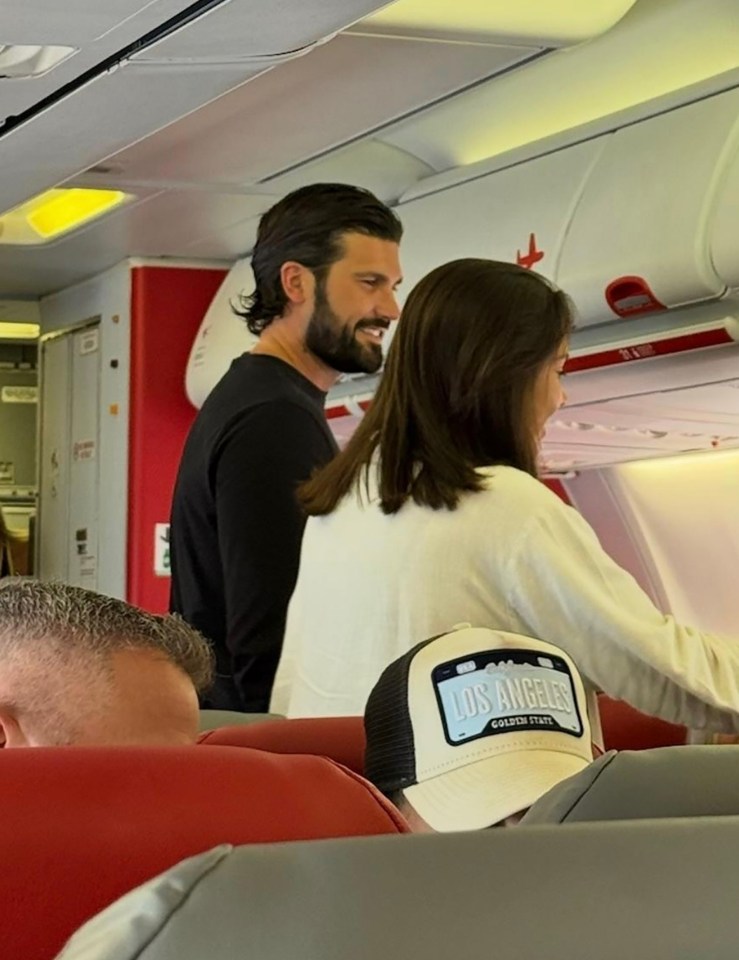 Dan Edgar and a mystery brunette on an airplane.