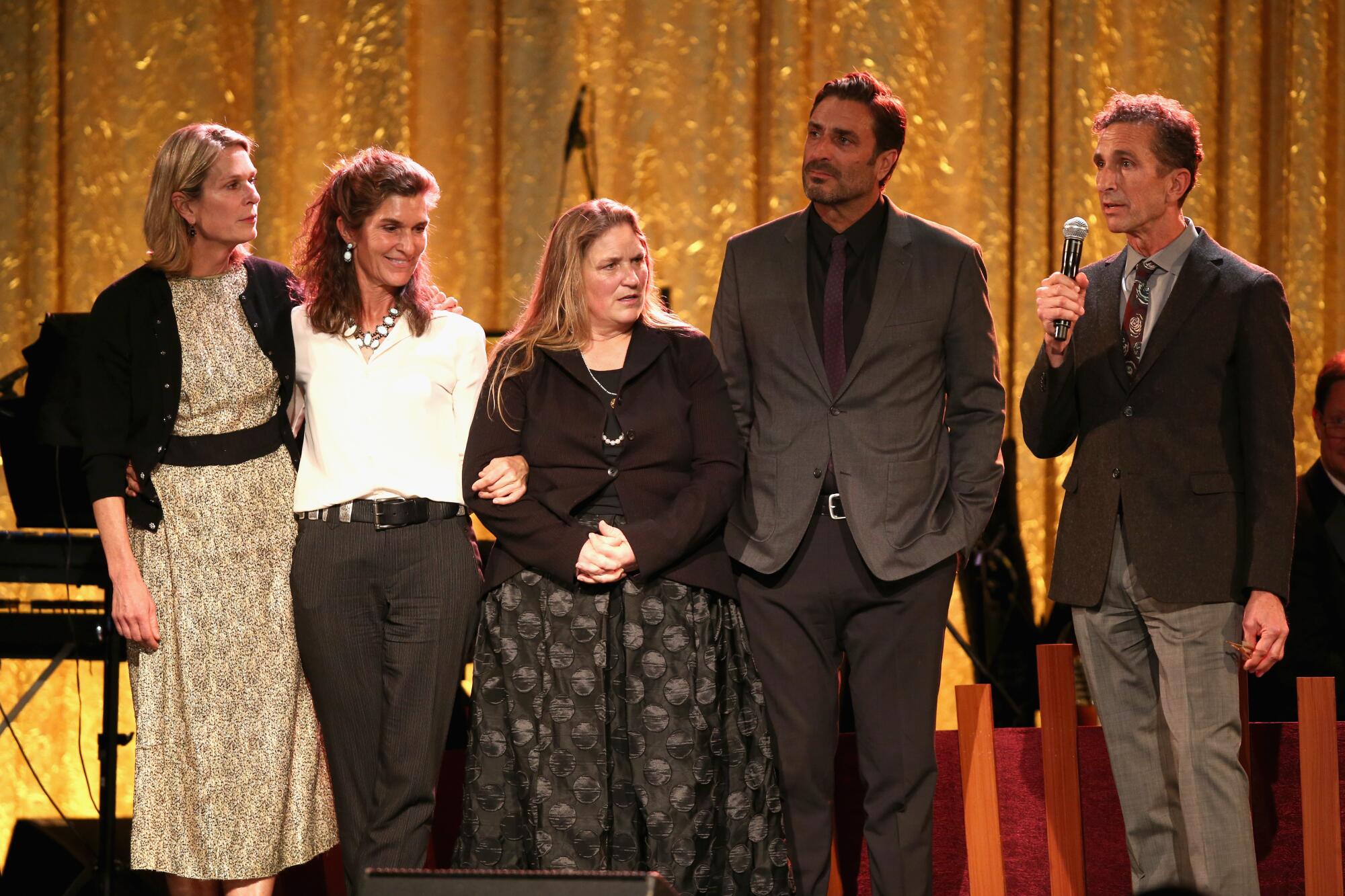 Five people speak onstage
