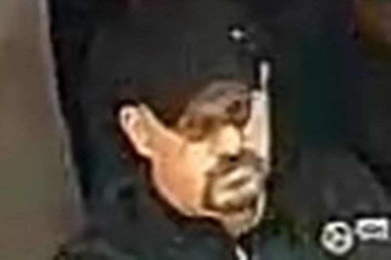 Low-resolution image of a man's face.