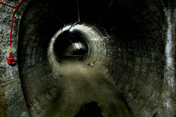 LONDON, UNITED KINGDOM:  A tunnel stands empty at the Aldwych Underground station in London 25 October, 2004. The Aldwych station is one of the London Underground's fabled "ghost stations," one of the several dozen stops which were abondoned for lack of use or, in some cases, never opened.     AFP PHOTO/NICOLAS ASFOURI  (Photo credit should read NICOLAS ASFOURI/AFP via Getty Images)