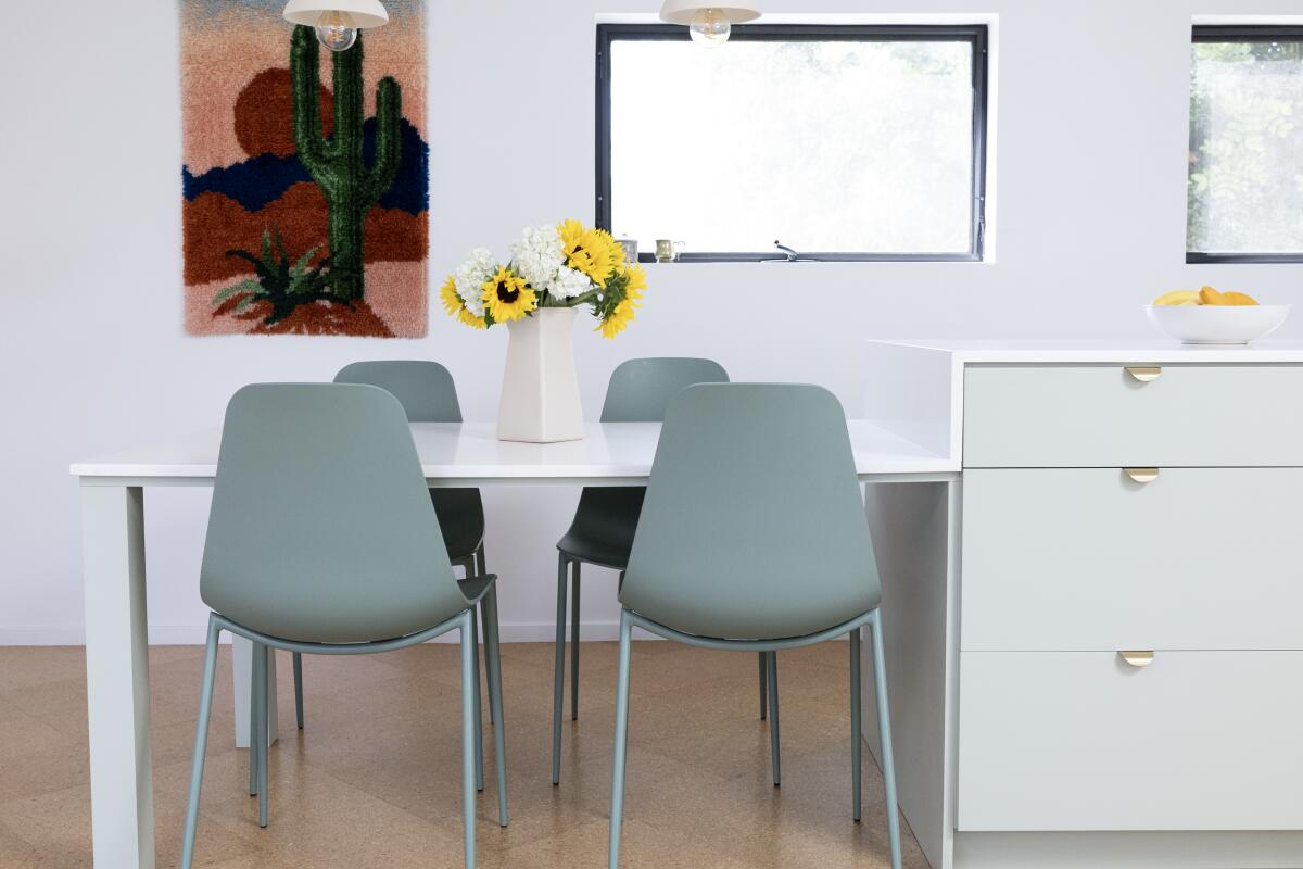 A waterfall island morphs into a dining table 
