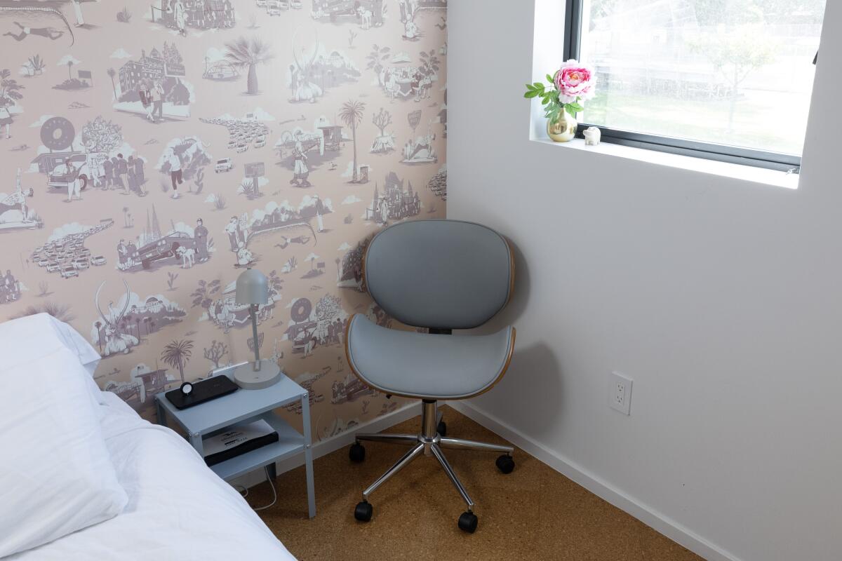Pink Los Angeles Toile wallpaper and a chair in the bedroom
