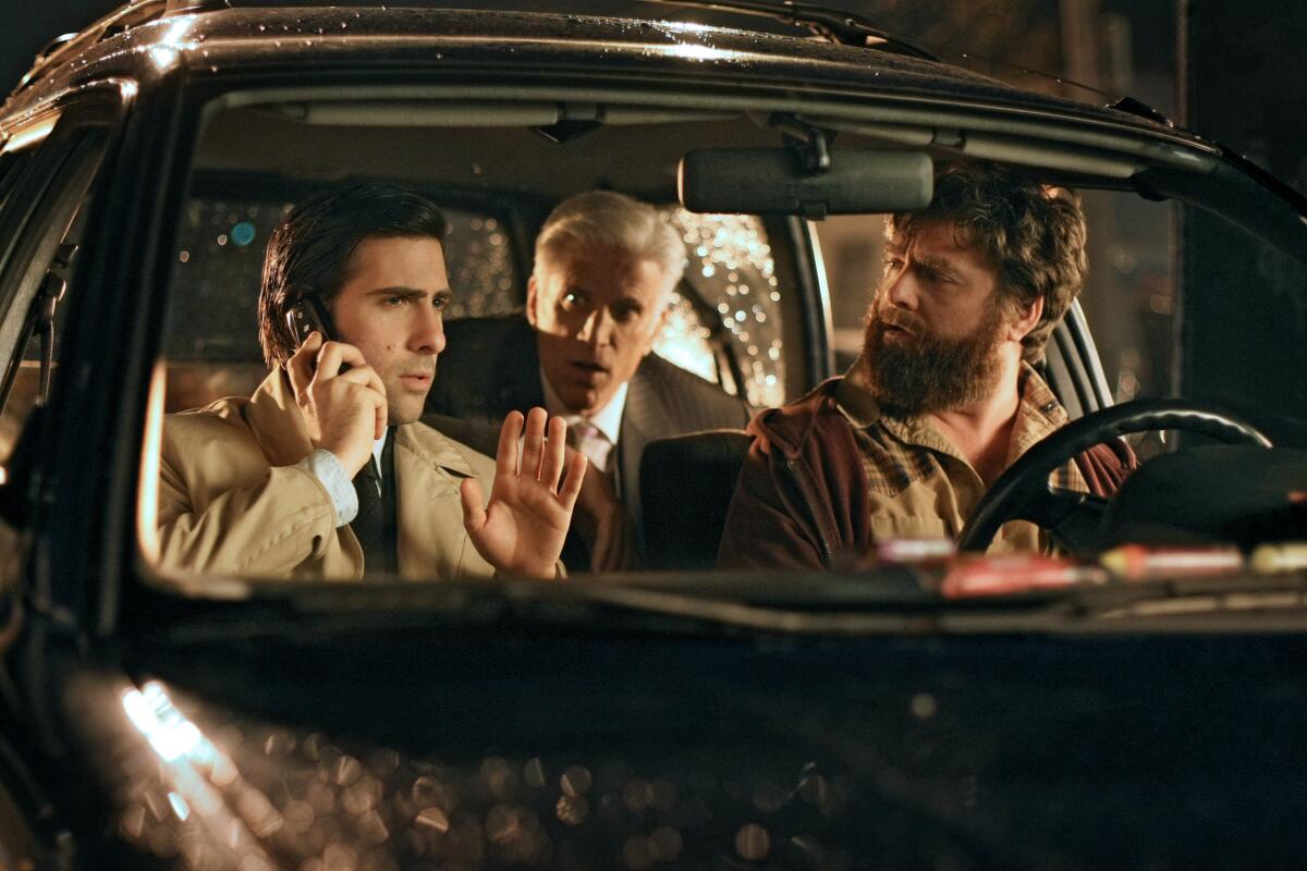 Three men sitting in a car